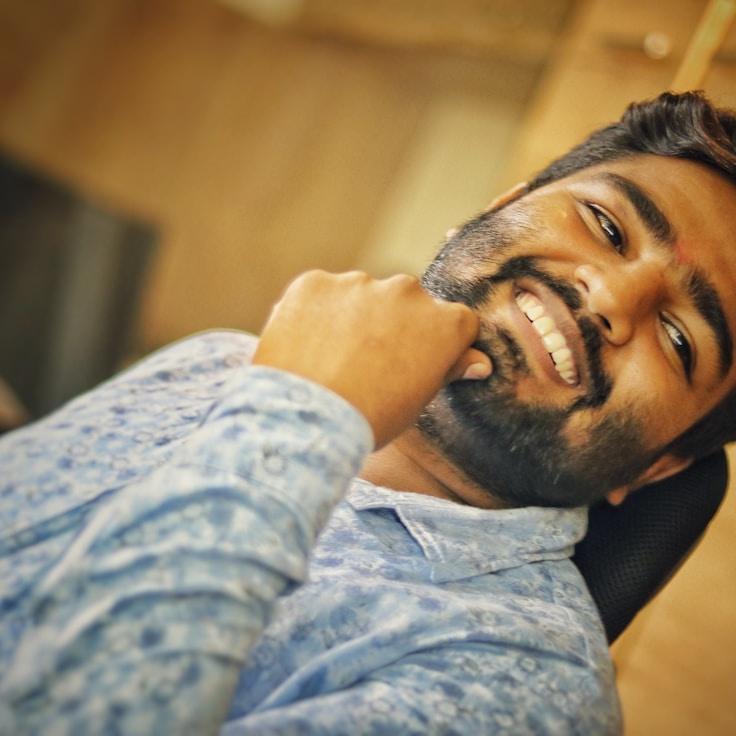 Kaveri Mehta, Lead Design Curator at FieldPulseWorks, reviewing corporate floral arrangements